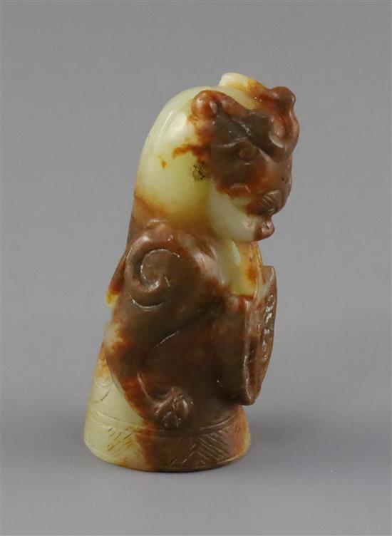 A Chinese pale celadon and russet jade finial, Song dynasty or later, H.5.4cm